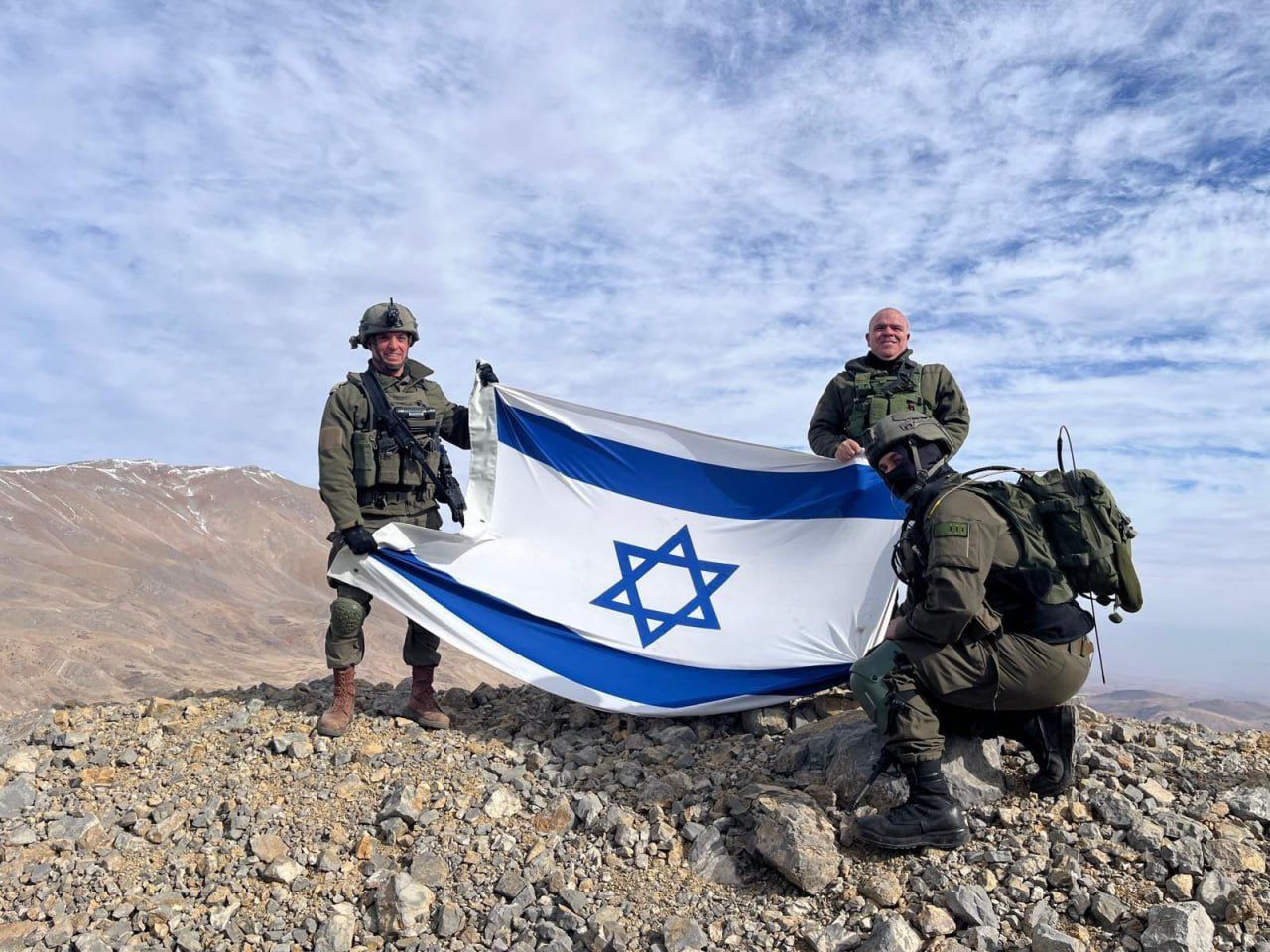 Israeli forces planting Israeli flag on Mt. Hernon in...